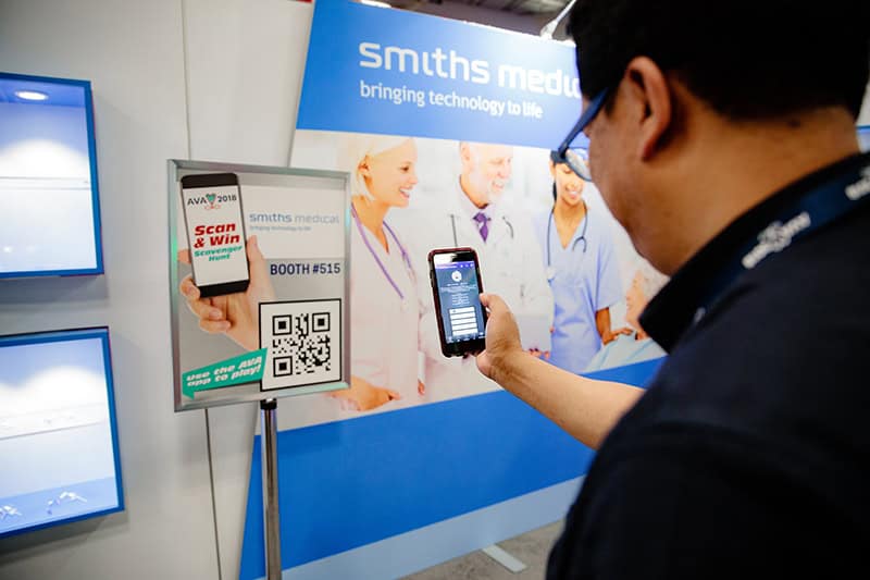 Attendee scans a QR code at AVA's annual conference for a chance to win prizes